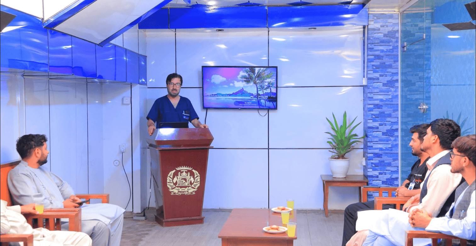 A physician presenting to a team session